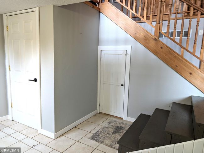 Storage closet and door to the attached garage | Image 7