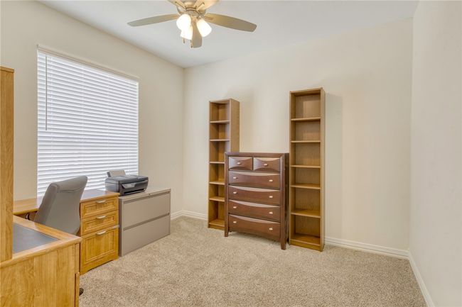 Office featuring a ceiling fan and light colored carpet | Image 30