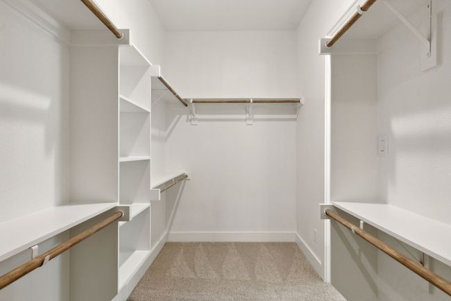 Walk in closet with light colored carpet | Image 4