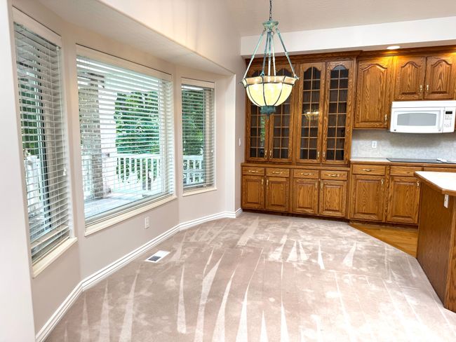 Kitchen breakfast nook with bay window. | Image 12