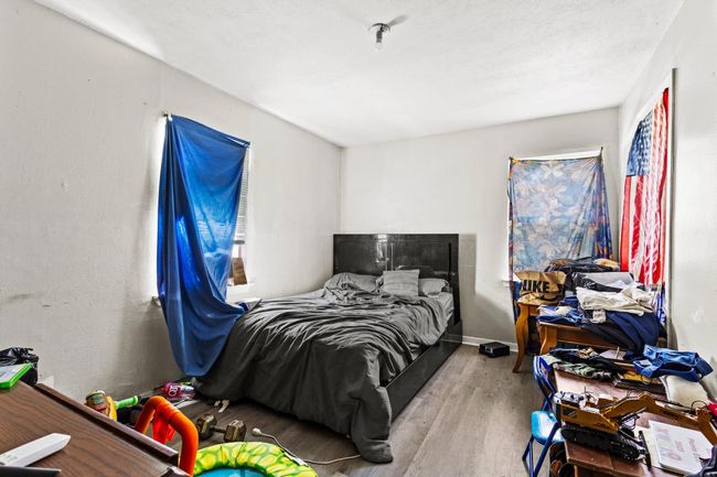 Bedroom featuring wood finished floors | Image 7