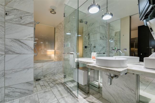 Full bath with marble look tiles and a stall shower | Image 30