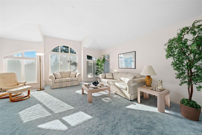 Expansive living areas, fresh neutral tones, and large, bright windows that flood the home with natural light! | Image 14