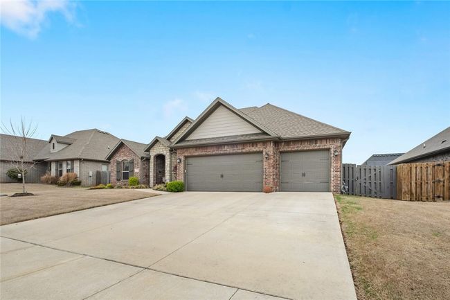 Spacious 3 car garage with in ground storm shelter. | Image 4