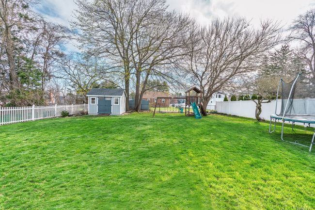 Huge flat lot, fenced in back yard, includes playscape | Image 37