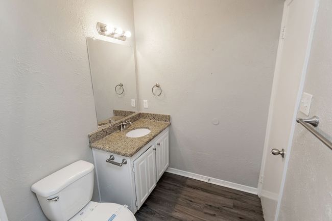 Bathroom with tiled shower and toilet | Image 19