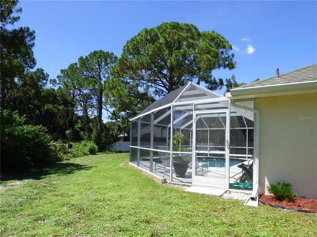wide pool cage, with all room around for long chairss | Image 5