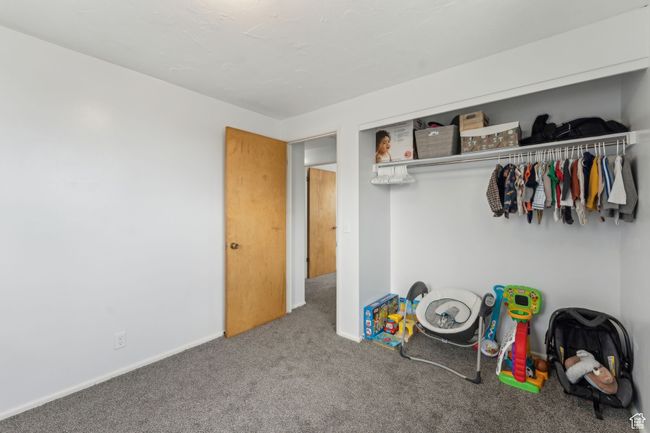 Interior space with carpet floors, a closet, and baseboards | Image 13