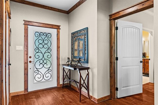 Entryway with crown molding and hardwood / wood-style flooring | Image 3