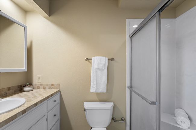 Bathroom with vanity and walk-in shower | Image 23