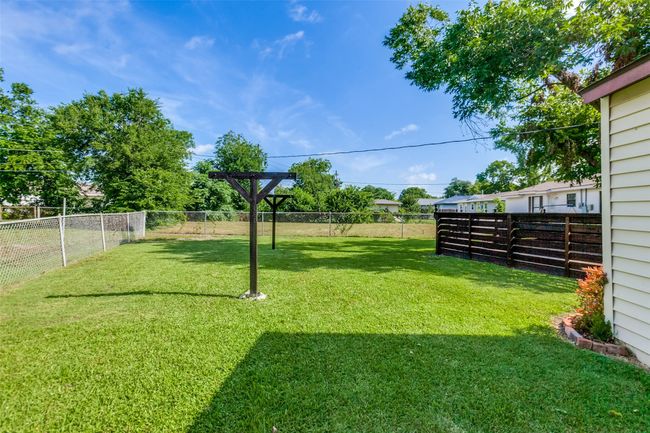 View of fenced backyard | Image 25