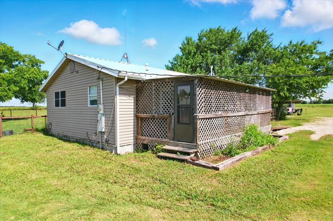 View of side of property with a metal roof | Image 6