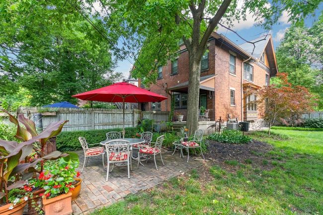 Amid mature trees, this delightful fenced yard is an idyllic haven to use and enjoy your way | Image 9