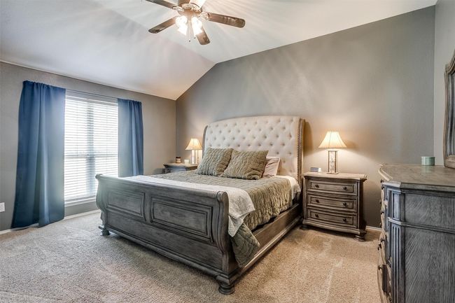 Bedroom with light colored carpet and ceiling fan | Image 24