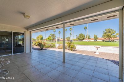 Covered north-facing patio with power security shutters. Views of No. 7 green and approach shots | Image 1