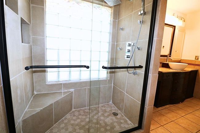 Upgraded master shower including a sleek new shower door | Image 13