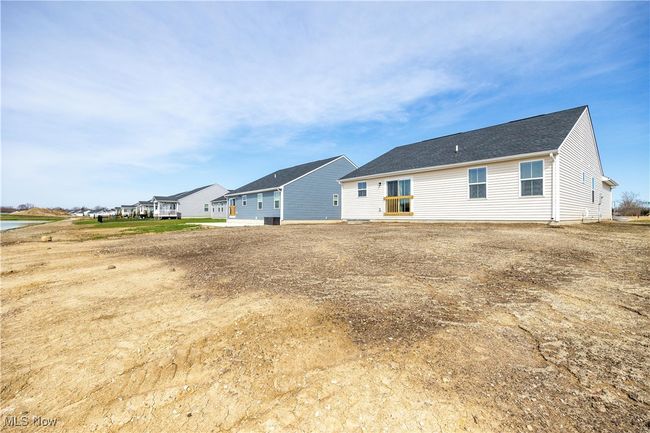 Back of house featuring a shingled roof | Image 35