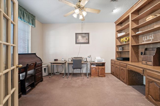 Private office with a wall of built-ins for displaying your achievement awards, favorite collectibles and books! | Image 19
