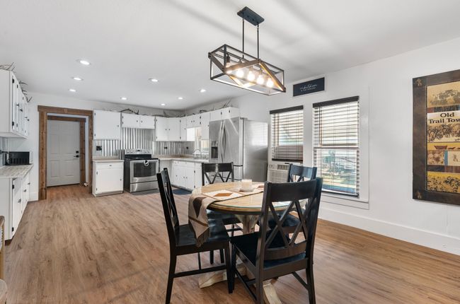 Dining area with recessed lighting, light wood-style floors, and baseboards | Image 5
