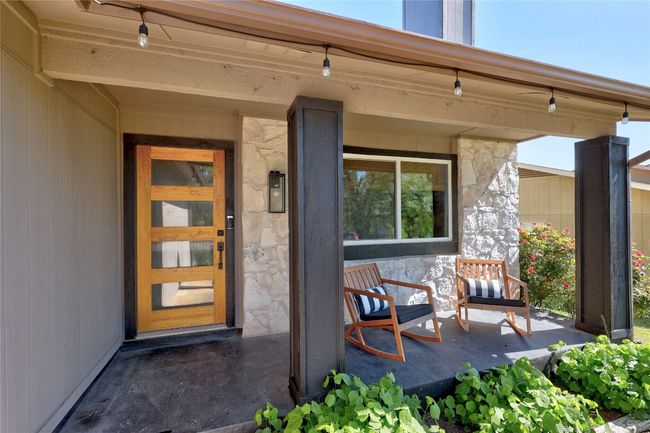 Entrance to property featuring covered porch and bistro lights | Image 5