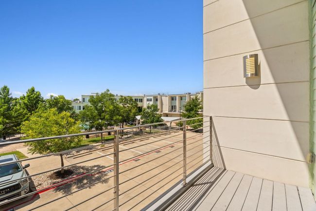 The balcony looks out at the pool. Close enough to see it, but far enough to still be quiet. | Image 19