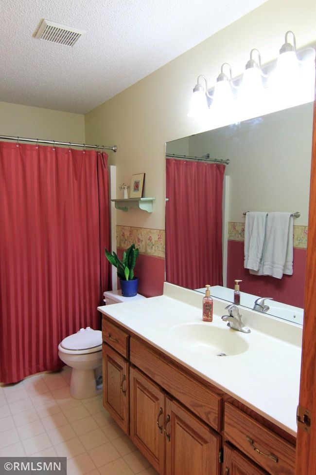Spacious 5th bedroom in lower level is currently used as an office/sewing room | Image 29