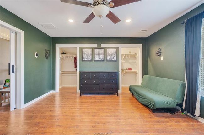 Sitting room with light wood-style floors, recessed lighting, and a ceiling fan | Image 24