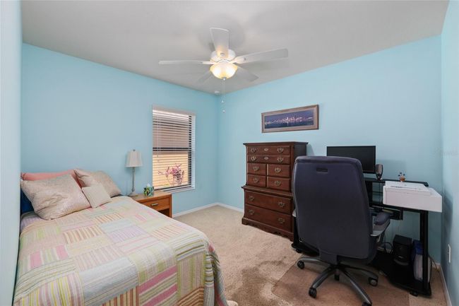 Bedroom 2 offers comfort and privacy, located apart from the primary suite. | Image 14
