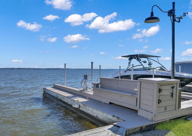 Your resident fisherman will love daytime or nighttime fishing from this custom bench with built-in storage and great overhead lighting. | Image 27