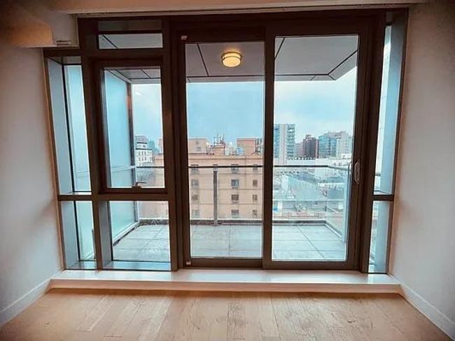 Entryway with baseboards, healthy amount of natural light, a view of city, and wood finished floors | Image 21