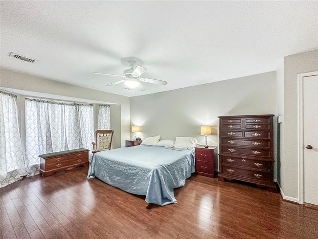 Primary bedroom is sizable for any furniture style. | Image 13