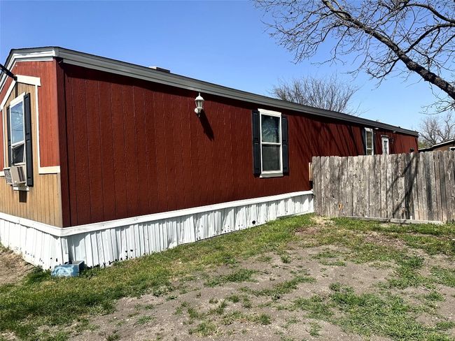 View of side of home featuring fence | Image 8