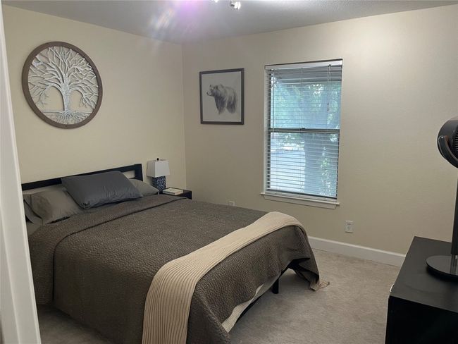 Bedroom with light colored carpet and baseboards | Image 9