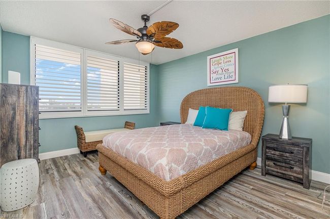 SOUTHERN EXPOSURE GUEST BEDROOM W/UPDATED FAN. PLANTATION SHUTTERS. WALK-IN CLOSET IS TO LEFT. | Image 20