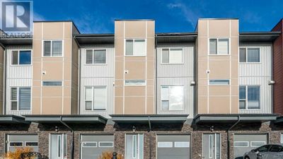 104 - 70 Saddlestone Dr Ne, Townhouse with 4 bedrooms, 3 bathrooms and 1 parking in Calgary AB | Image 1