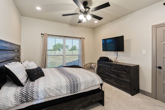 Carpeted bedroom with ceiling fan and recessed lighting | Image 10