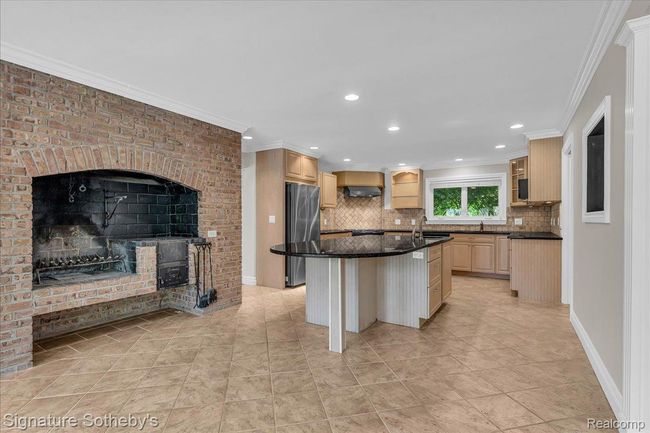Kitchen with Indoor Grill, Peninsula Island, Granite Counters & Maple Cabinets | Image 11