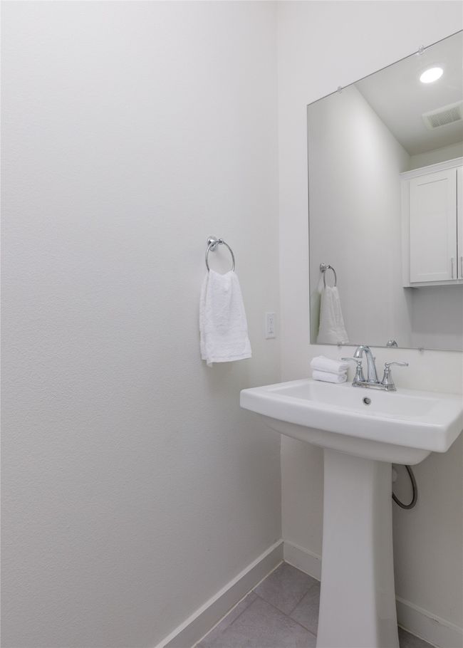 Bathroom featuring baseboards and tile patterned floors | Image 25