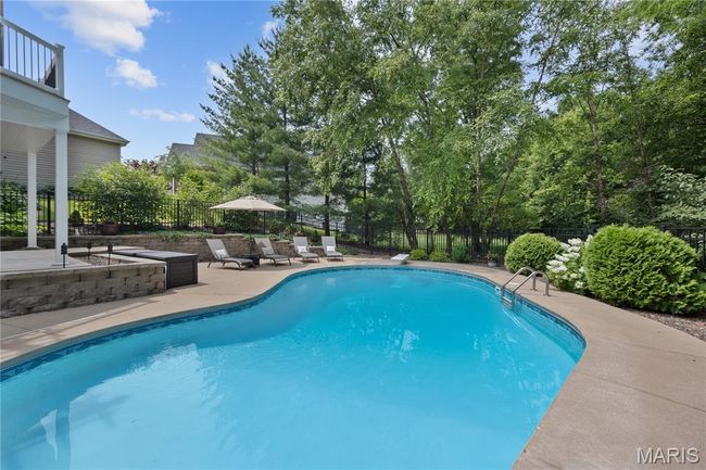 View of pool featuring a patio area and a fenced backyard | Image 68