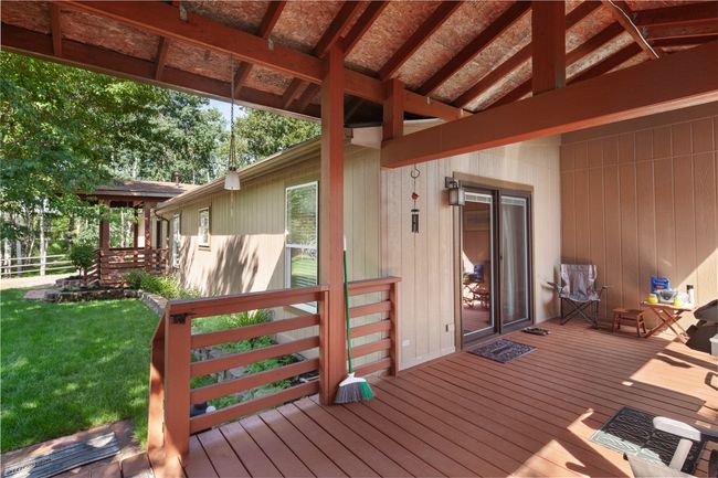 Wooden deck with a lawn | Image 43
