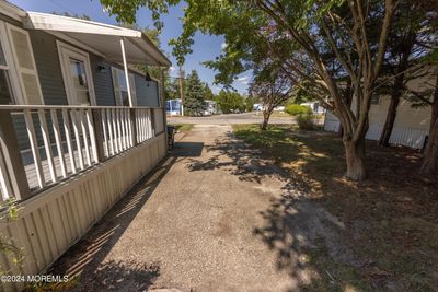 Over-sized Driveway With Mature Landscaping Adding to Privacy of this Special lot. | Image 2