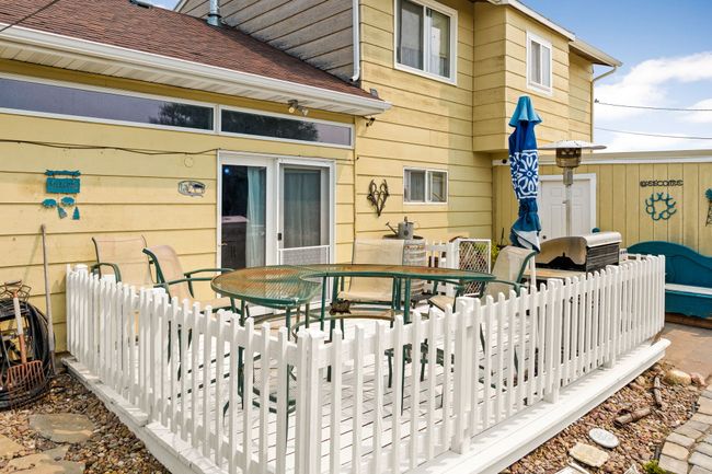 Wooden deck featuring fence and outdoor dining space | Image 27
