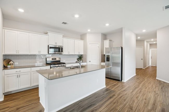 Center island is perfect for some bar stools. | Image 10