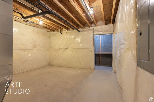 Unfinished basement featuring electric panel | Image 33