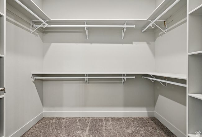Walk in closet with carpet flooring | Image 31