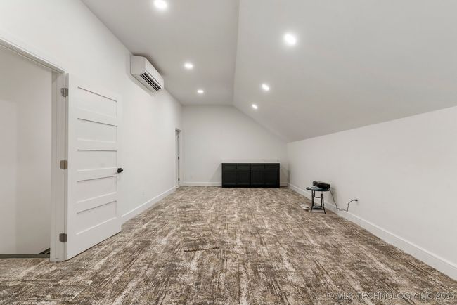 Upstairs game room or theatre room with bathroom | Image 61