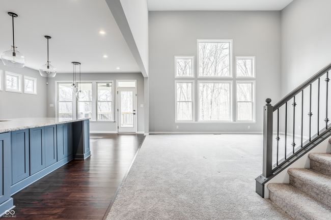 View from the entry into the great room. There are gorgeous windows which provide an abundance of natural light. | Image 9