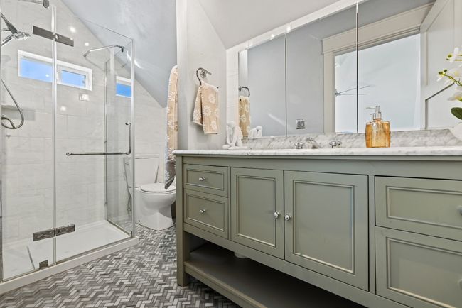 Upstairs Bathroom featuring vanity, a stall shower, and lofted ceiling | Image 37