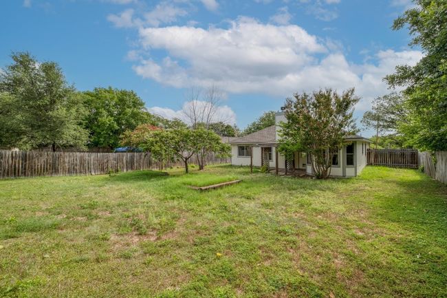 View of fenced backyard | Image 25