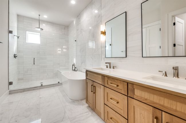Full bath featuring a freestanding bath, and oversized shower | Image 14